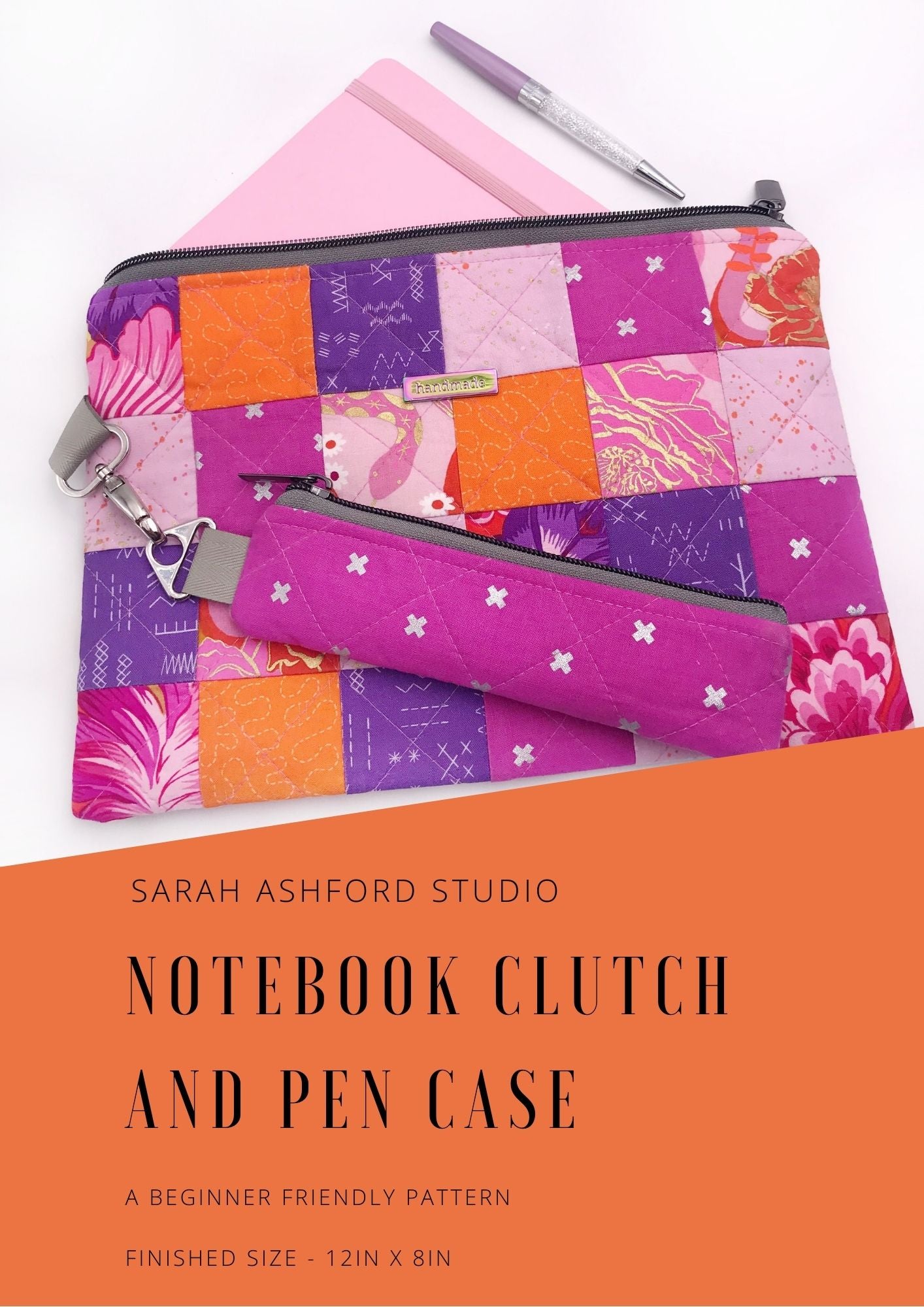 Sewing pattern. A zipiper bag made up of small purple, pink and orange squares holds a notebook and pen. Attached by a keyring is a pencil case in pink fabric, to coordinate with the main case.